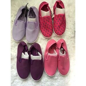 4 Pairs of girls slip on sneakers. Size Large. New With Tags